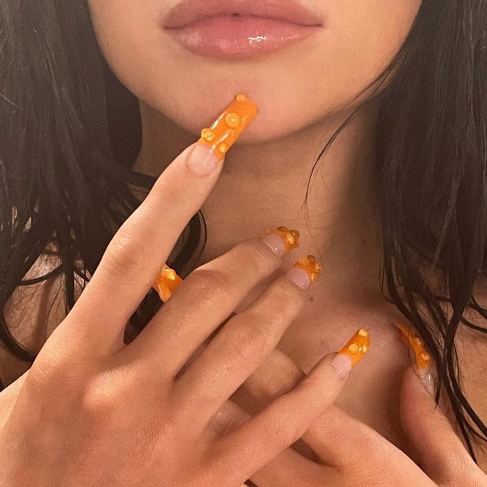 Kylie Jenner Mocked For Her Long Orange Fake Nails As Fans Claim