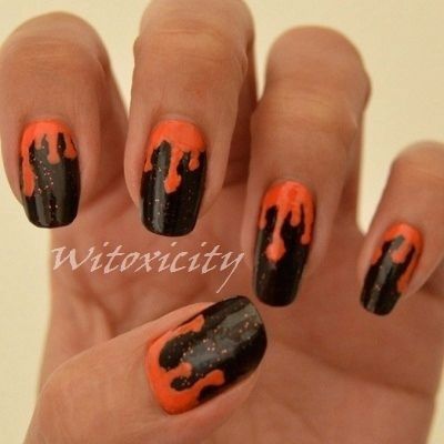 Orange Nails With A Black Drip